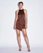 Brown silk satin halter top with vertical pleated panel styled with matching asymmetrical mini skirt