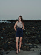 Side view of Maia cocktail mini dress showing embroidered tulle bodice and structured satin skirt